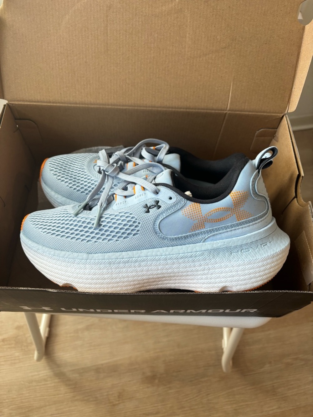 Under Armour Women’s Light Blue Sneakers with Orange Logo Accents